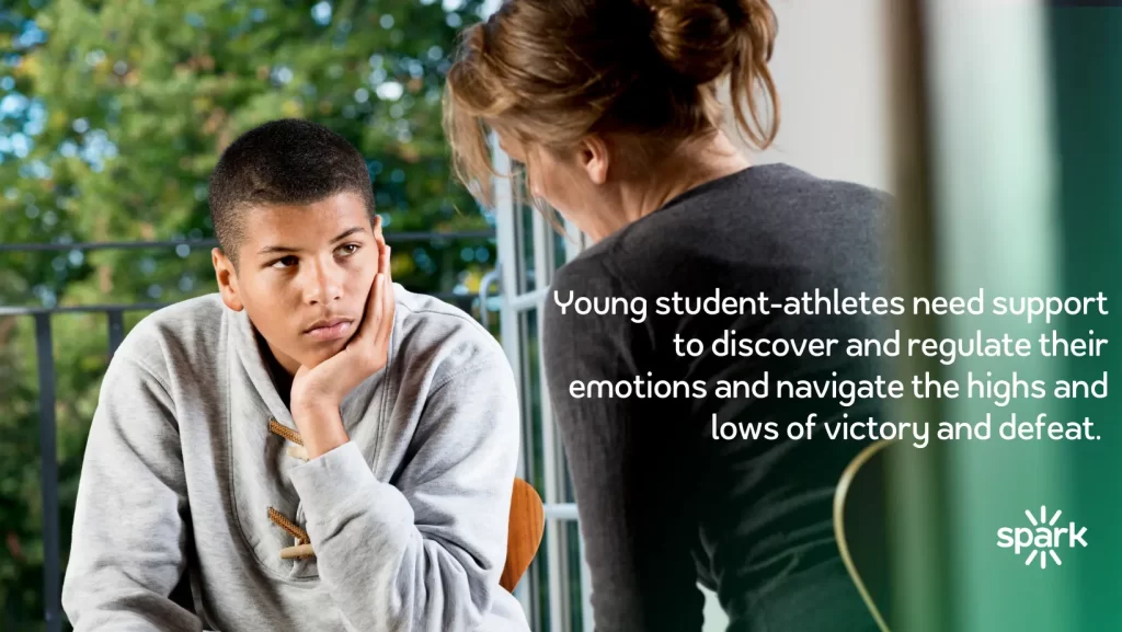 student athlete getting emotional support from school